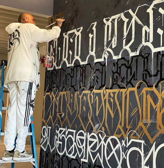 Big Sleeps painting a site specific mural at Museum of Graffiti - 2022