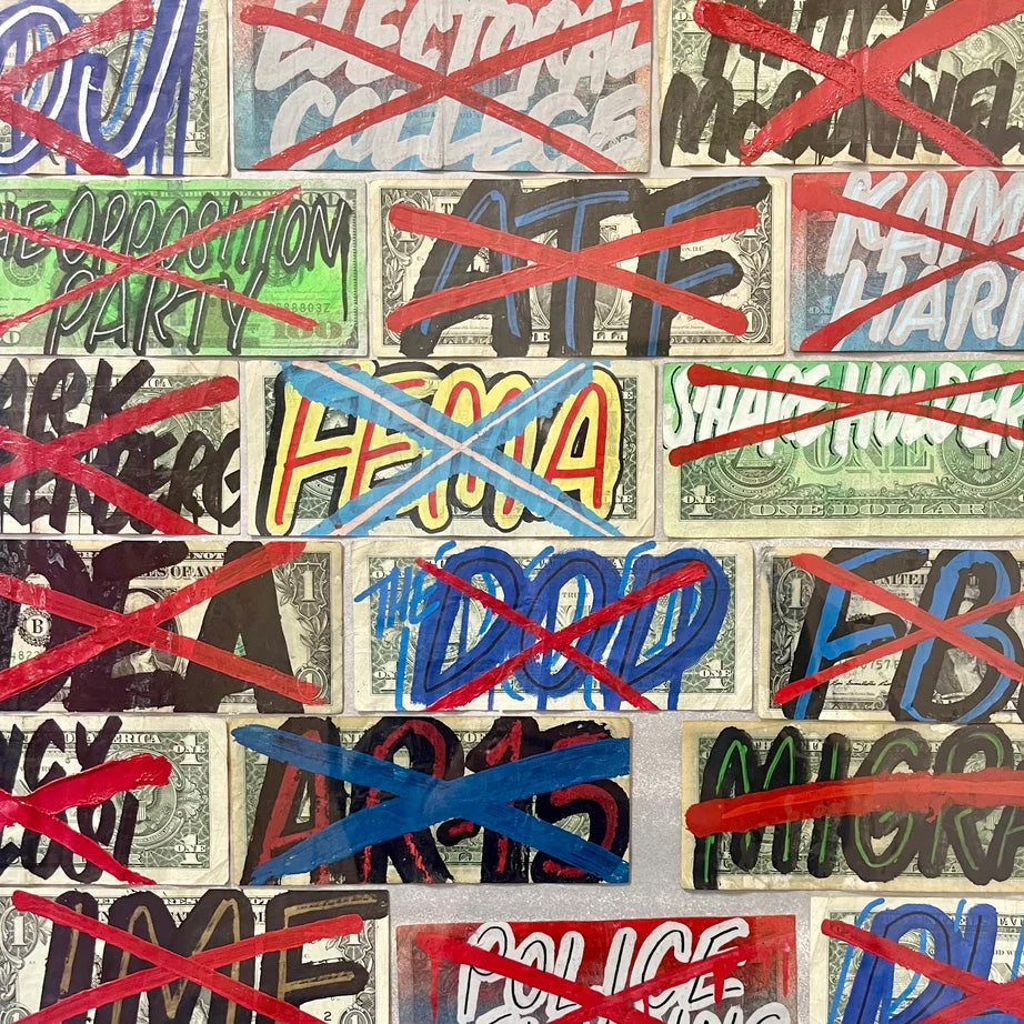 Layered graffiti tags in red, blue and black on a wall by Cash4.