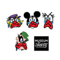 Four cartoon face graphics arranged on a white background, with a black square logo reading 'Museum of Graffiti' at the bottom right.